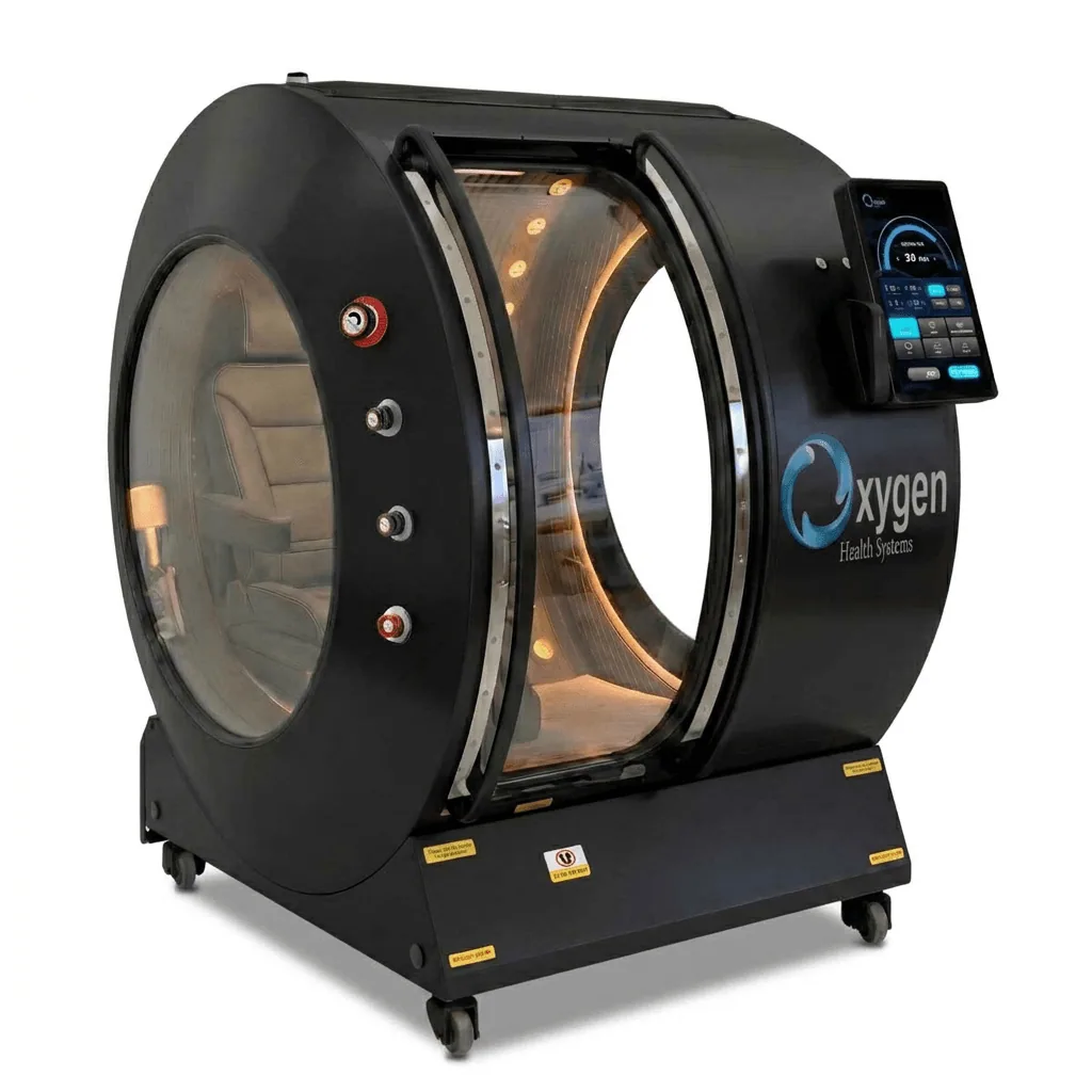 Vital Sphere 360 matte black hard-shell hyperbaric oxygen chamber on caster wheels with a large oval viewing window, illuminated cream interior, and external touchscreen control panel
