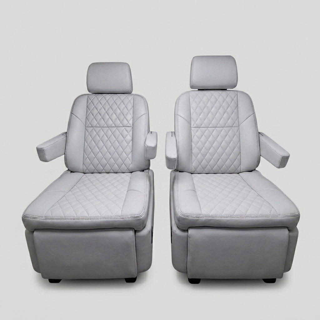 Premium light gray quilted leather captain's chairs reclined with footrests extended, showing electric reclining and footrest adjustment